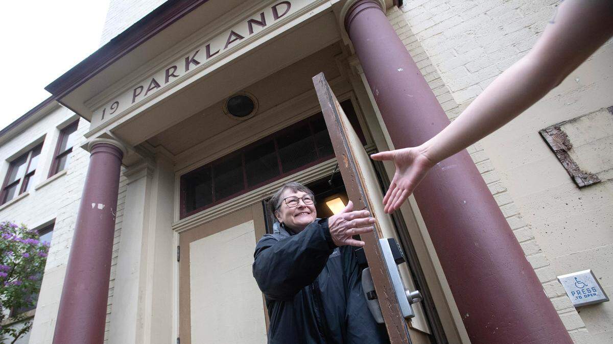 Wendy Freeman, co-secretary of the Parkland Community Association, greets visitors to the former Parkland School building in Parkland, Washington, on Tuesday, June 4, 2024. The association purchased the building with plan of turning it into a community center and multi-agency hub.