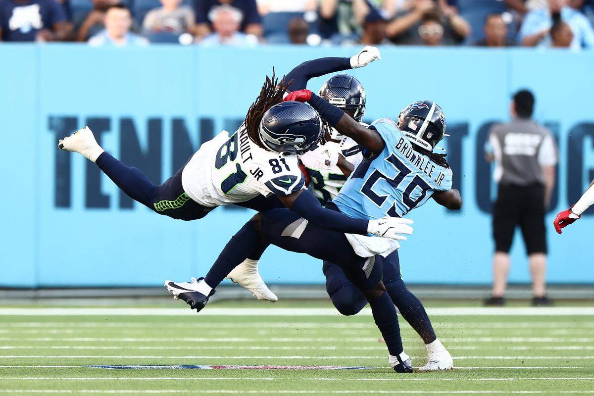 Aug 17, 2024; Nashville, Tennessee, USA; Tennessee Titans cornerback Jarvis Brownlee Jr. (29) tackles Seattle Seahawks wide receiver Laviska Shenault Jr. (81) in the first quarter of the game at Nissan Stadium. Mandatory Credit: Casey Gower-USA TODAY Sports