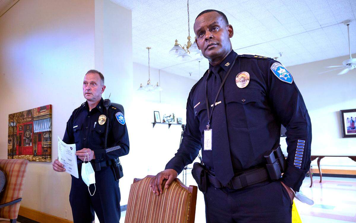 Tacoma Police Chief Avery Moore (right) and Deputy Chief Paul Junger address the city’s new crime prevention plan during the Hosmer Business Association meeting at the Tacoma Nursing & Rehabilitation Center on Hosmer Street in Tacoma, Washington on Wednesday, June 22, 2022.