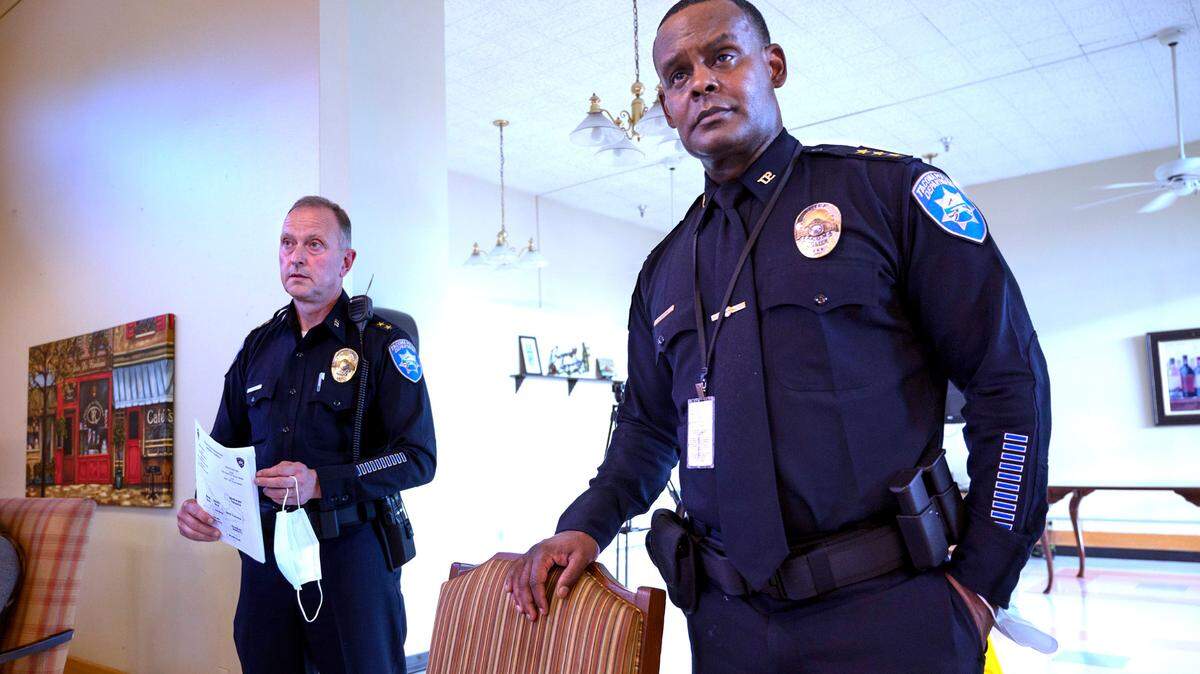 Tacoma Police Chief Avery Moore (right) and Deputy Chief Paul Junger address the city’s new crime prevention plan during the Hosmer Business Association meeting at the Tacoma Nursing & Rehabilitation Center on Hosmer Street in Tacoma on June 22, 2022.