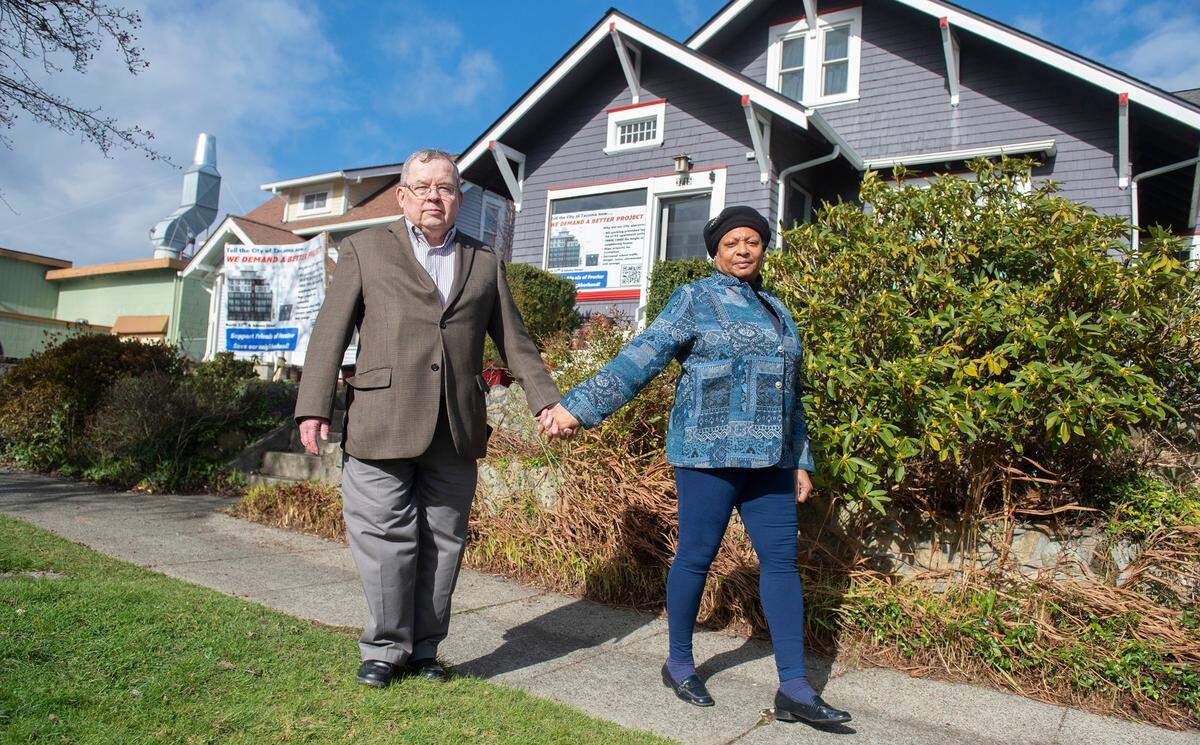 Mike and Paula Lonegar outside their 110-year-old bungalow in the Proctor neighborhood of Tacoma, Washington, on Tuesday, Feb. 23, 2021. A six-story apartment building just feet from the LonegarÕs property has been approved for construction by the City of Tacoma.