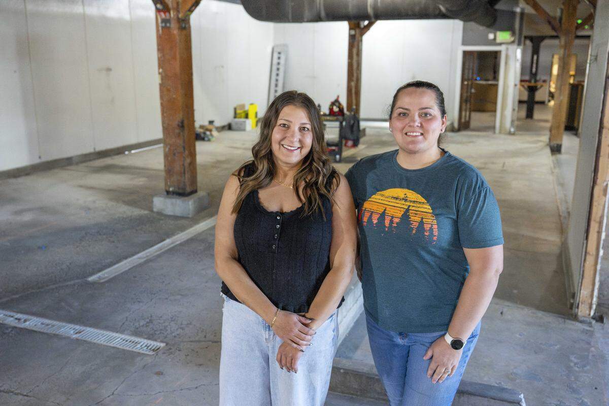 Co-owners Jordan Zenisek, left, and Susan Saccone stand on the future playscape at Sunrise Play Cafe on Wednesday, Sept. 24, 2025, in Tacoma, Wash.