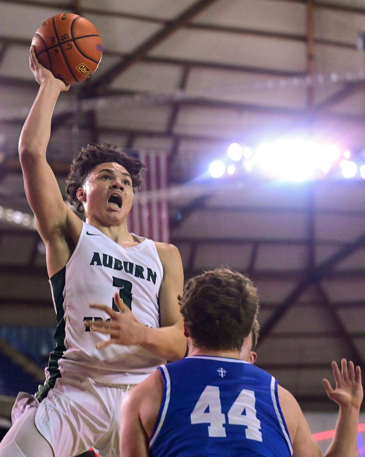 Auburn guard Maleek Arington (3) attempts a shot as Seattle Prep forward Austin Harnetiaux (44) defends during the second quarter of a Class 3A semifinal state tournament game on Friday, March 4, 2022, at the Tacoma Dome, in Tacoma, Wash.