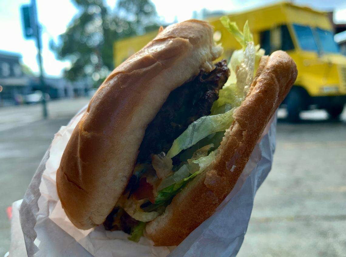 Bomb Burger, a new food truck from the owners of It’s Greek To Me, is posted at 2515 6th Ave., serving $5 burgers and crispy fries from a bright yellow truck.