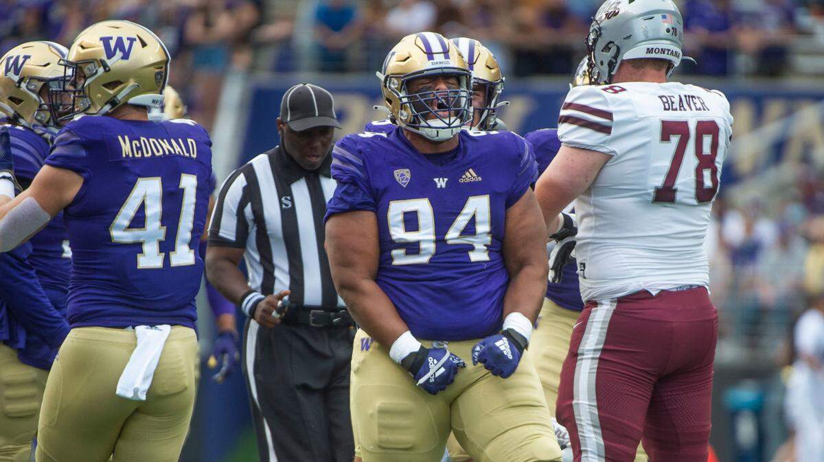 Sam Taimani roars after making a tackle.The Washington Huskies played the Montana Grizzlies at Husky Stadium in Seattle, Wash., on Saturday, Sept. 4, 2021.