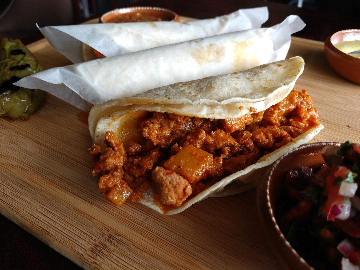 Pineapple-spiked al pastor tacos from Ta Carbon.