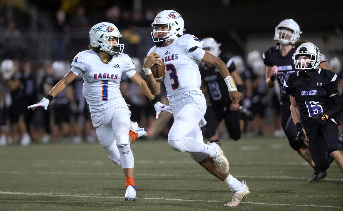 Graham-Kapowsin quarterback Joshua Wood (3) is escorted to the end zone by receiver Julian Mason during Saturday night’s 4A SPSL high school football game against the Sumner Spartans at Sunset Chev Stadium in Sumner, Washington, on Oct. 16, 2021. The play was called back because of a holding penalty.