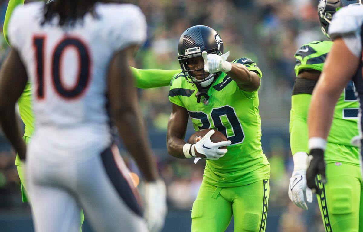 Seattle Seahawks cornerback Michael Jackson (30) celebrates after recovering a fumble by Denver Broncos running back Melvin Gordon III (25) in the third quarter of an NFL game on Monday, Sept. 12, 2022, at Lumen Field in Seattle.