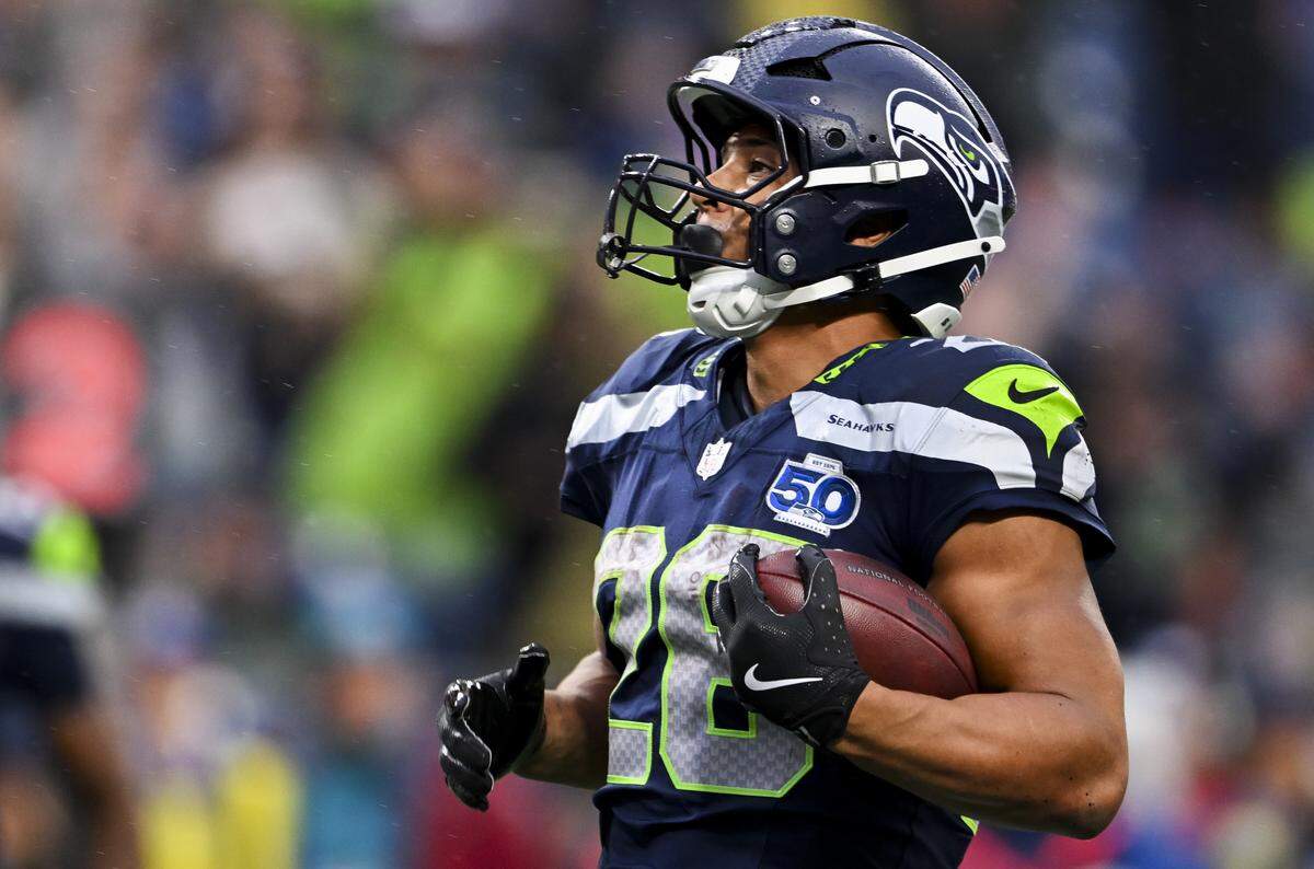 Seattle Seahawks running back Zach Charbonnet (26) walks in a touchdown during the first quarter of the preseason game against the Kansas City Chiefs at Lumen Field, on Friday, Aug. 15, 2025, in Seattle.