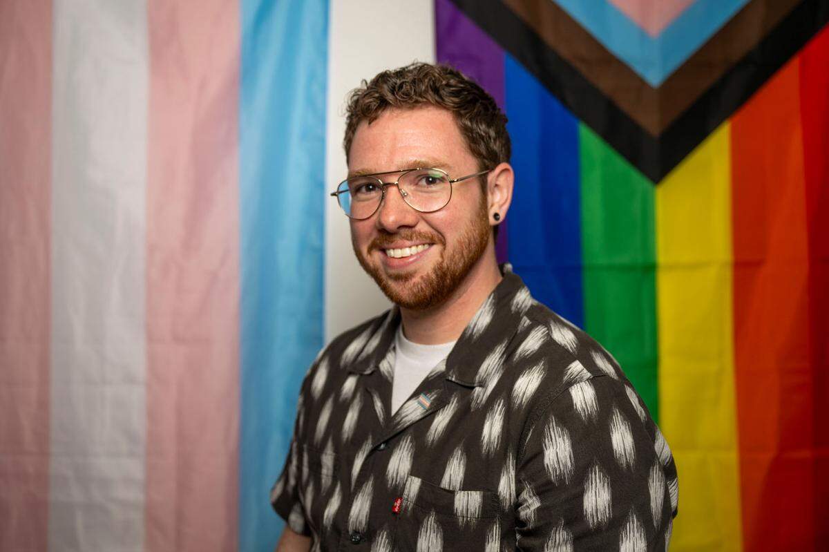 Charlie Best, 30, poses for a portrait inside his office at the Rainbow Center on Monday, July 3, 2023, in Tacoma. Best is the education manager at the center in downtown Tacoma.