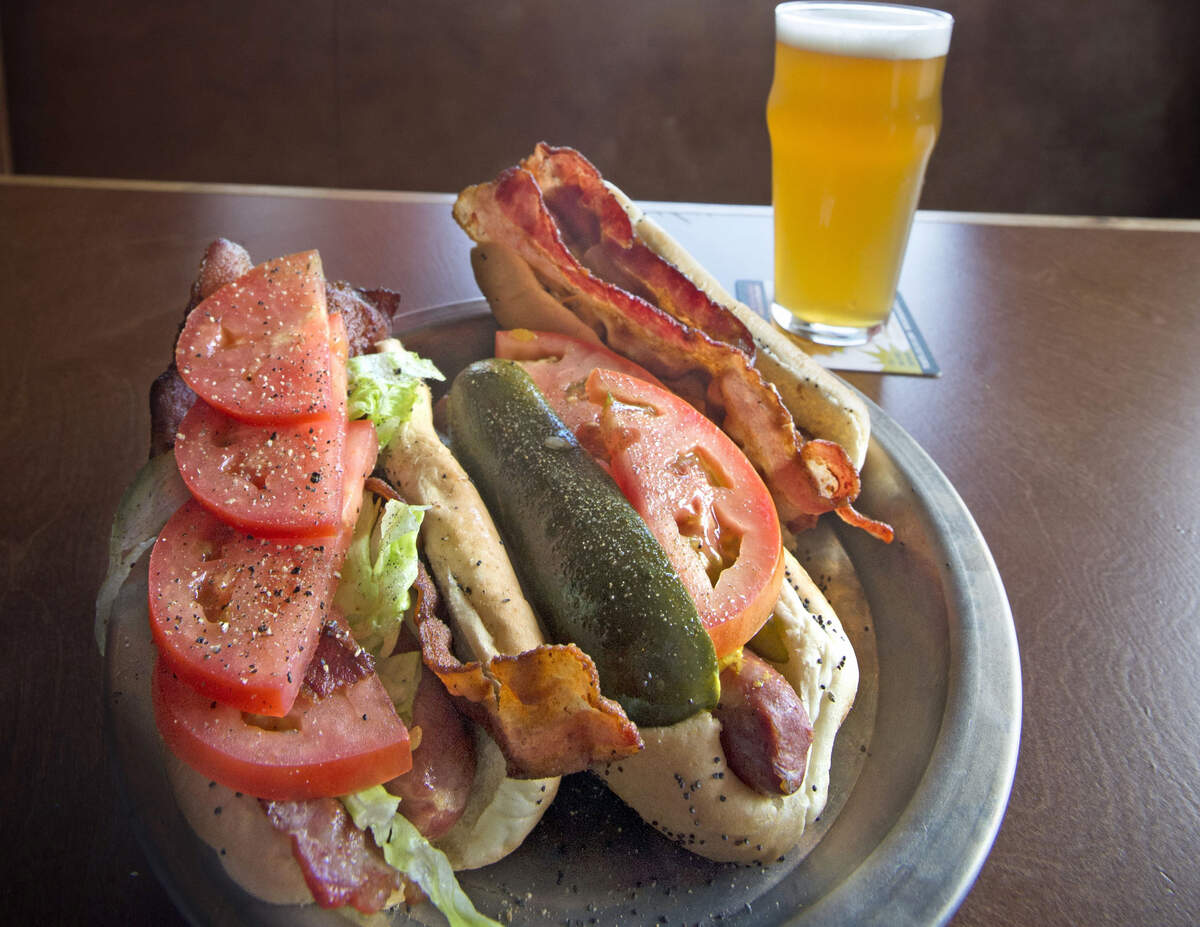 The BLT hot dog, left, the Chicago-themed Tacoma hot dog, center, and Hosmer Hound Dog from Red Hot in Tacoma.