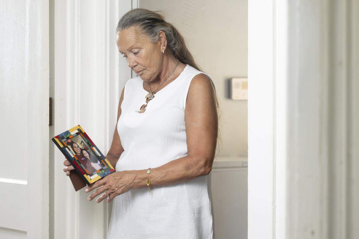 Joyce Robinson holds a photo of her granddaughters Ka'Lani Buchanan, left, and Kassidy Buchanan, 14, on Tuesday, Aug. 5, 2025, at Robinson's home in Tacoma, Wash. Kassidy has been missing since the fall of 2024.