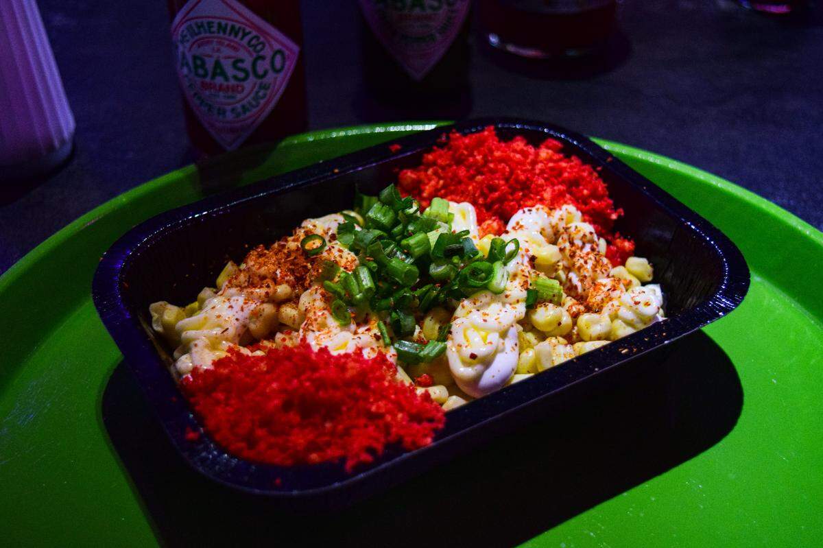 The Cheesy Cobb Crunch esquites-style corn includes crema, mayo, butter, scallions and Hot Cheeto dust.