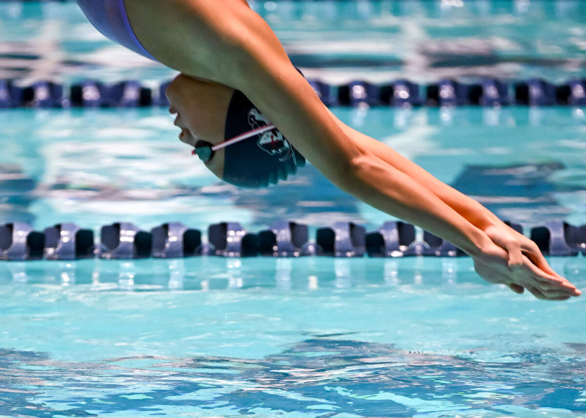 Curtis’s Takara Putt warms up before the 4A Girls State Swim & Dive Championships at Weyerhaeuser King County Aquatic Center, on Saturday, Nov. 11, 2023, in Federal Way, Wash.