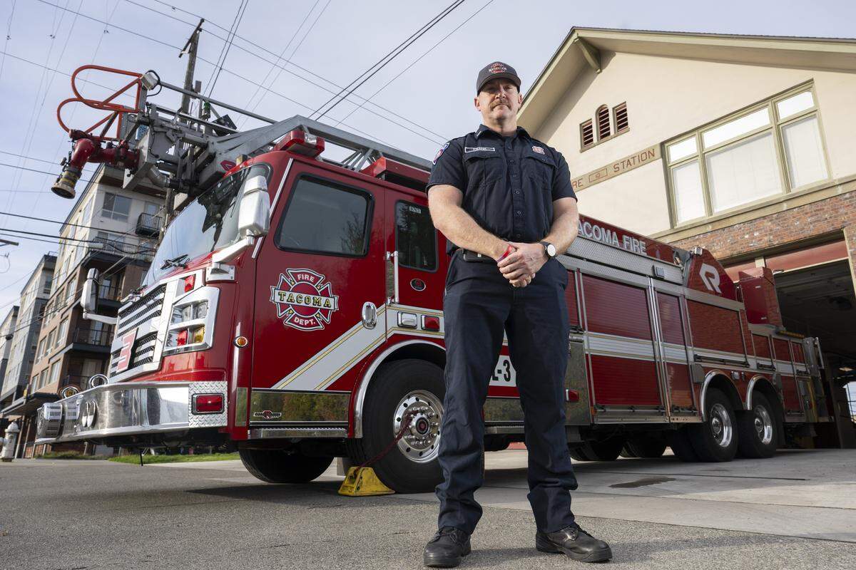 Matt Frank, a two-time cancer survivor and lieutenant firefighter at Station 13, stands for a portrait on Friday, Jan. 9, 2026, at the station in Tacoma, Wash.