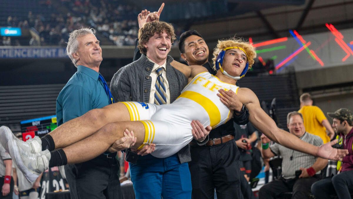 Fife’s William Conroy is held up by his coaches as he celebrates after defeating Toppenish’s Fabricio Alvarez to win the Class 2A, 165-pound state title on Saturday, Feb. 22, 2025, at Mat Classic XXXVI at the Tacoma Dome in Tacoma, Wash.
