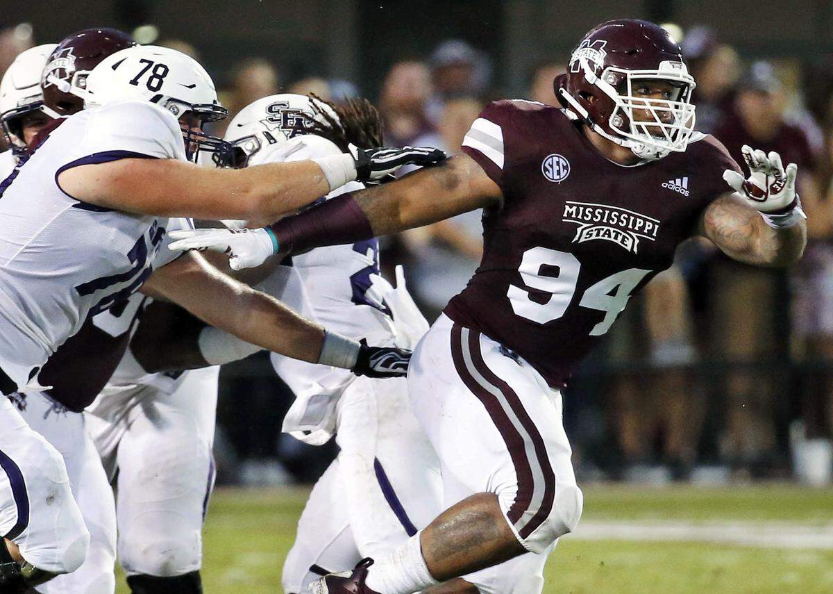 FILE- In this Sept. 1, 2018, file photo, Mississippi State defensive tackle Jeffery Simmons (94) pushes through a double team during the first half of an NCAA college football game against Stephen F. Austin in Starkville, Miss. Simmons is a possible pick in the 2019 NFL Draft. (AP Photo/Rogelio V. Solis, File)