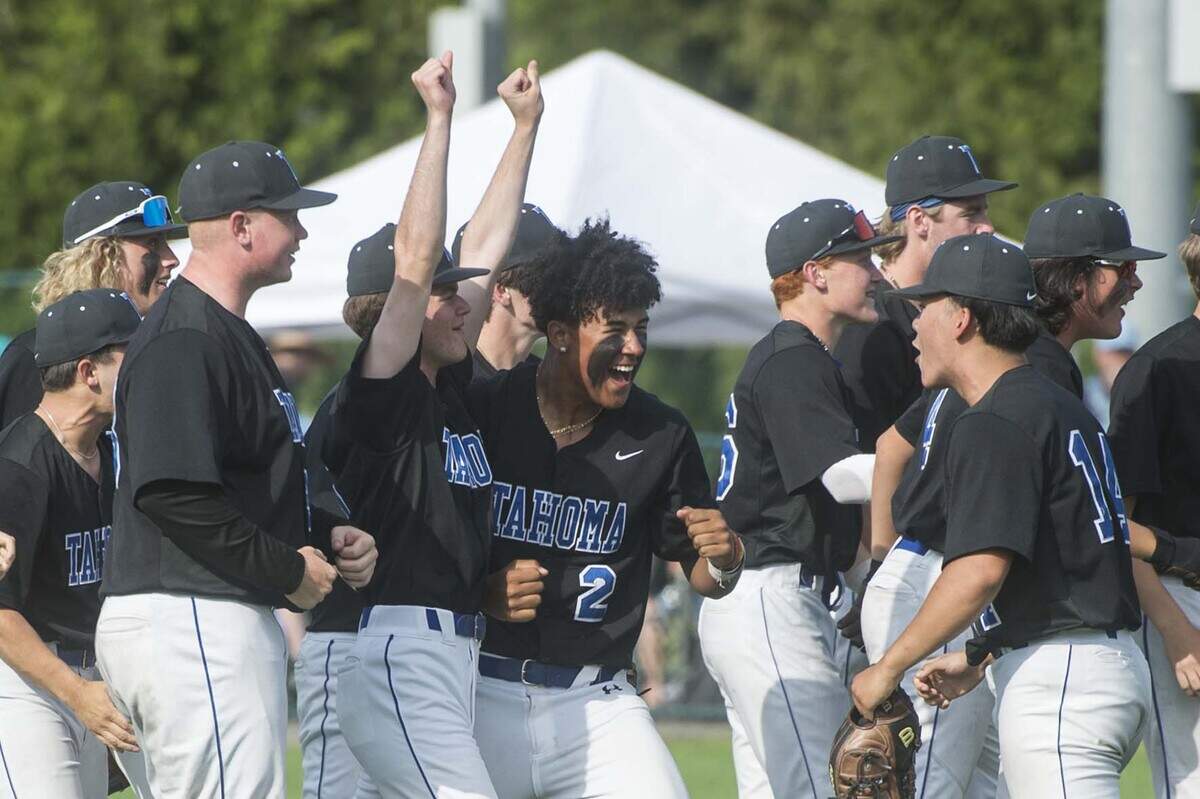 Tahoma starter Adam Jay (14) celebrates with teammates following a win over Olympia in the Class 4A baseball state quarterfinals on Saturday, May 20, 2023 at the Regional Athletic Complex in Lacey, Wash.