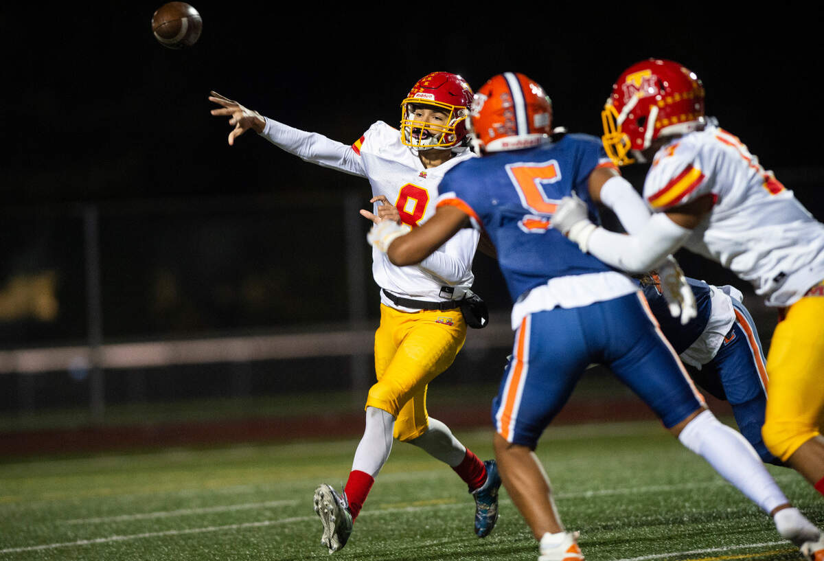 Mount Tahoma quarterback Derrik McKinney, 8, passes the ball in the second quarter of a Thursday night game at Harry E. Lang Stadium in Lakewood, Wash. on Oct. 27, 2022. Lakes defeated Mount Tahoma 51-14.