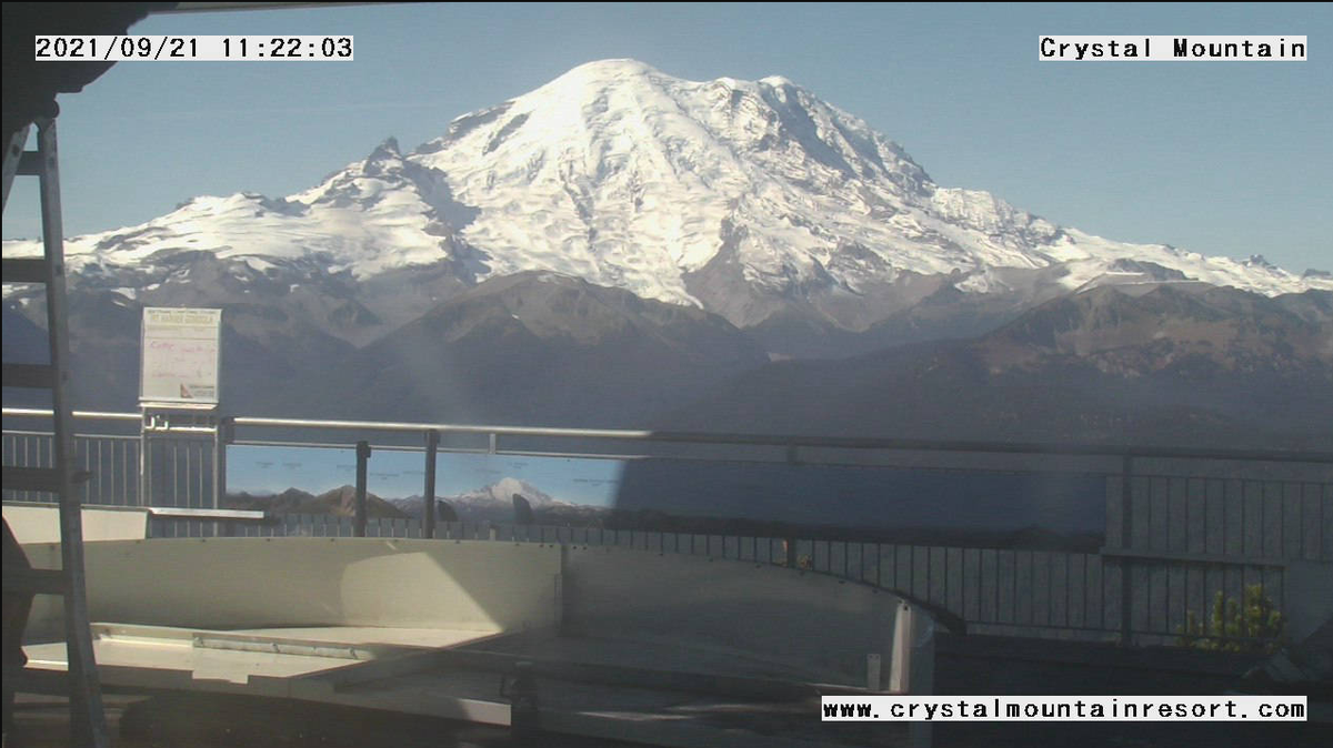 Images of Mount Rainier captured a week apart show how recent weather has helped replenish the mountain’s previously naked slopes, Sept. 21, 2021.