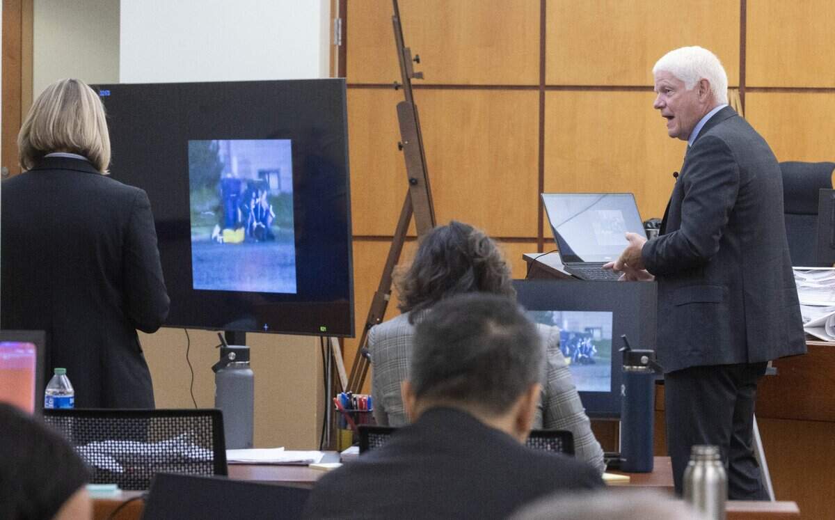 Grant Fredericks, a video forensic expert, right, explains what is happening in still images taken from a video projected from a computer of the arrest of Manny Ellis in Pierce County Superior Court in Tacoma Wednesday, October 4, 2023. At left is prosecuting attorney Lori Nicolavo. (Ellen Banner / Pool Photo - The Seattle Times)