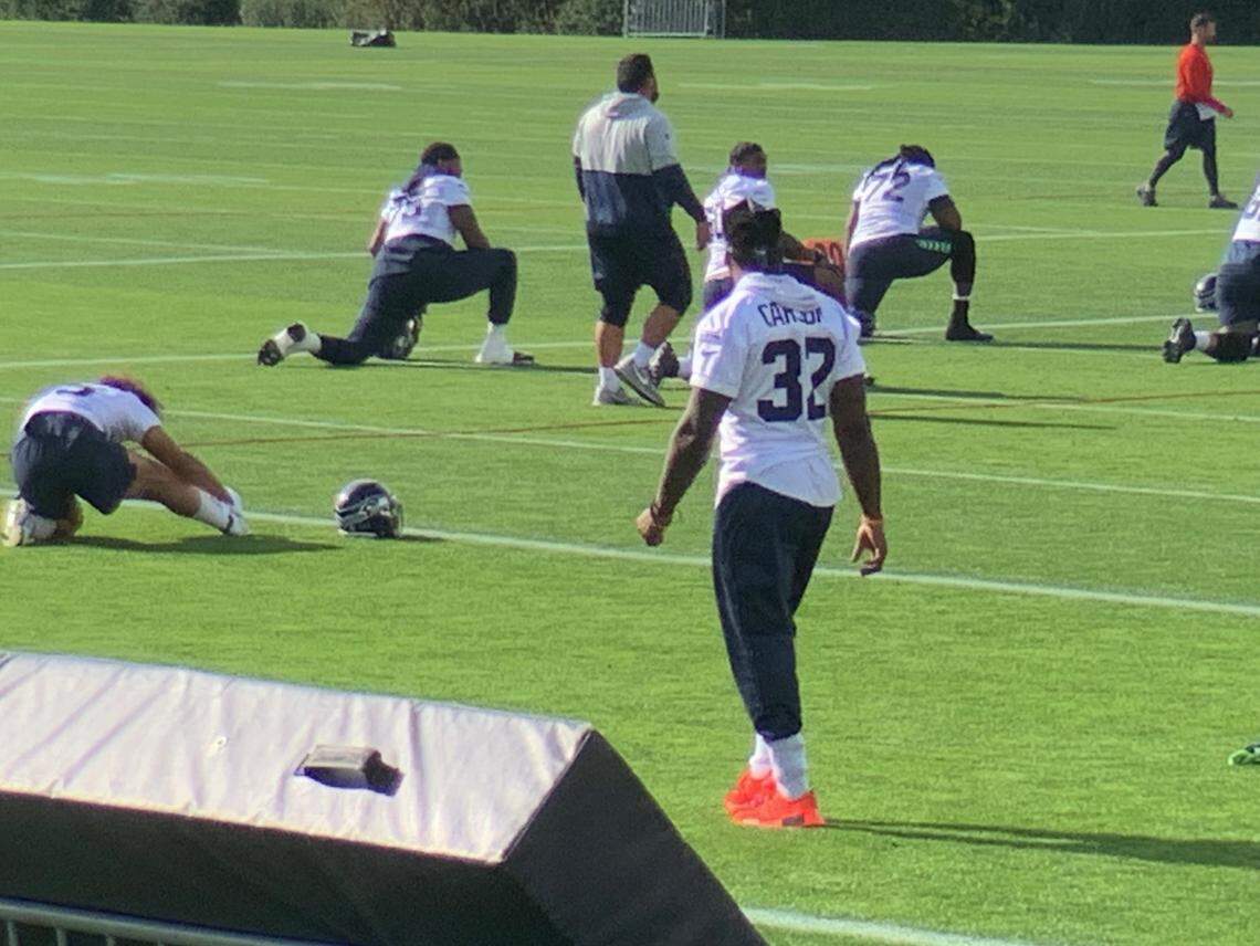 Running back Chris Carson (32) again not participating in practice because of a neck condition, four days before the Seahawks without Russell Wilson play the Steelers in Pittsburgh.