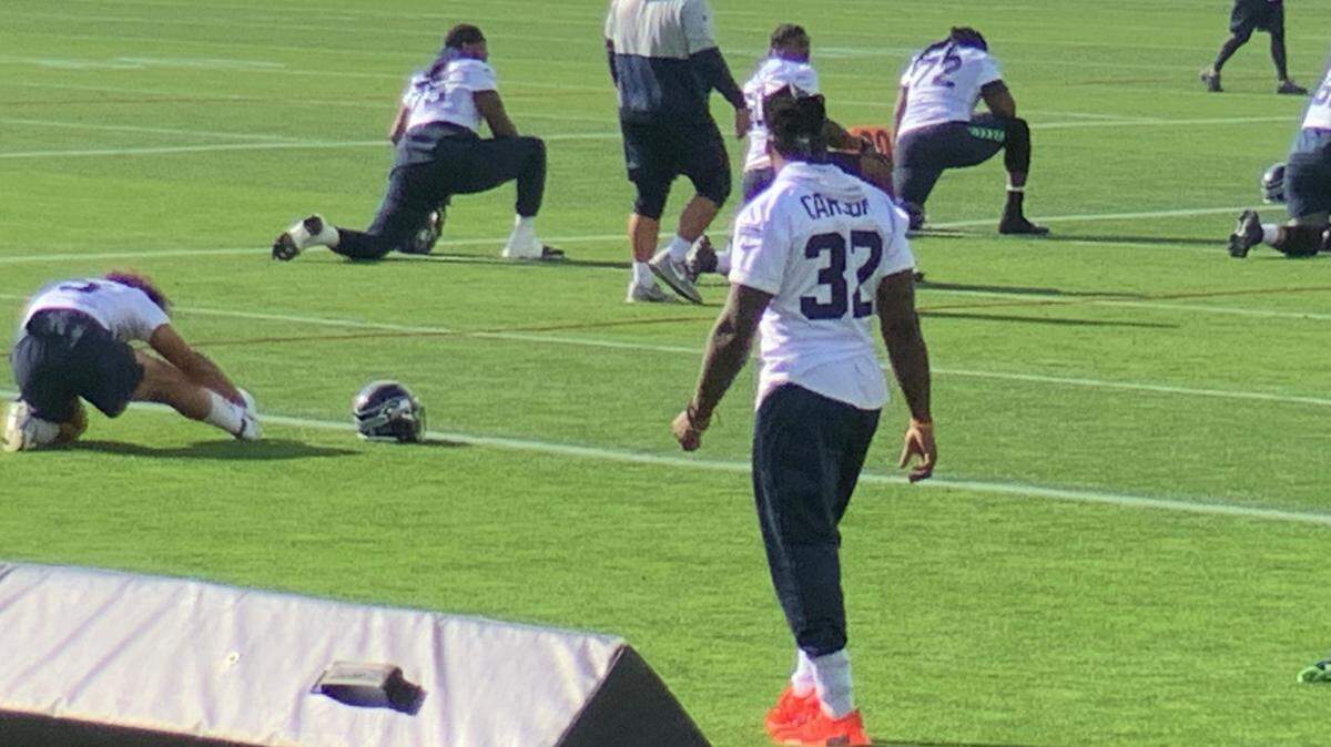 Running back Chris Carson (32) again not participating in practice because of a neck condition, four days before the Seahawks without Russell Wilson play the Steelers in Pittsburgh.