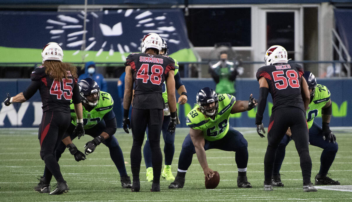Seattle Seahawks offensive lineman Damien Lewis lines up at center during the game. The Seattle Seahawks played the Arizona Cardinals in a NFL football game at Lumen Field in Seattle, Wash., on Thursday, Nov. 19, 2020.