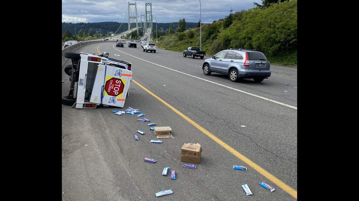 A three-wheeled ice cream truck tipped over on state Route 16, east of the Tacoma Narrows Bridge Monday evening.