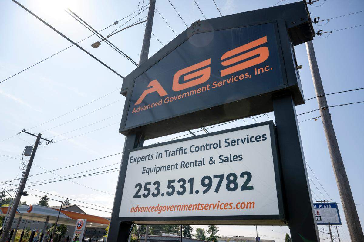 A sign for Advanced Government Services stands along Pacific Avenue on Tuesday, June 24, 2025, in Tacoma, Wash. The Minority Business Development Agency helped Arti O’Brien, the president of Advanced Government Services, collaborate with a designer to review and approve the design after O’Brien acquired the company in 2016.