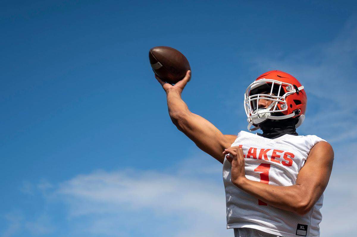 Lakes quarterback Legend Galeai throws a pass during route drills at practice on Friday, Aug. 18, 2023, at Lakes High School in Lakewood, Wash.