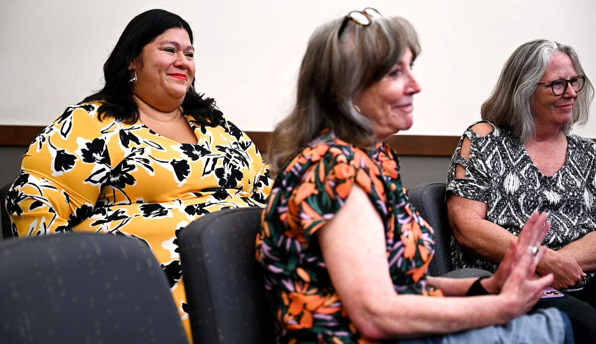 Olgy Diaz, left, smiles after being voted by the Tacoma City Council to be their new member during a city council meeting the at the Tacoma Municipal Building in Tacoma, Wash. on Aug. 9, 2022.