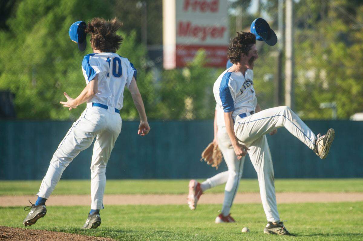 Stadium first baseman Logan Judish (10) and third baseman Tristan Luxenberg (9) celebrate the Tigers’ win over Gig Harbor in the opening round of the Class 3A state baseball playoffs on Tuesday, May 16, 2023 at Heidelberg Sports Complex in Tacoma, Wash.