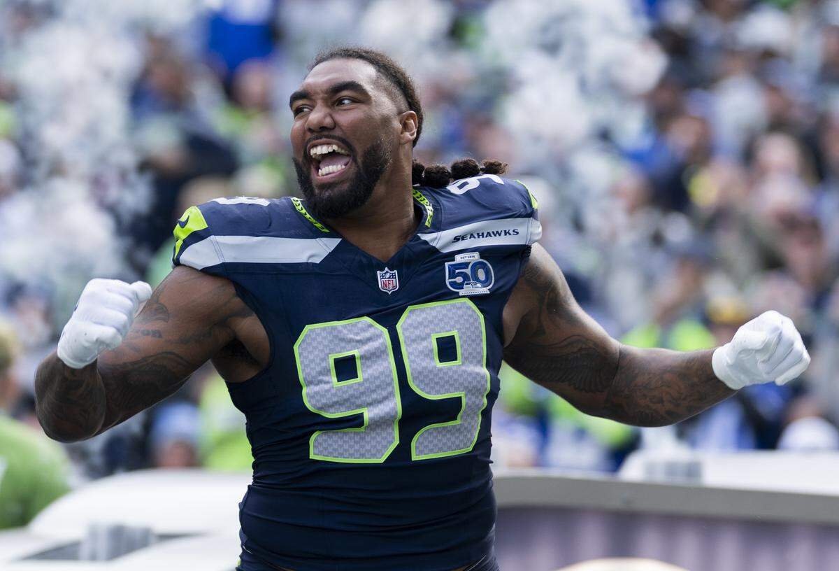 Seattle Seahawks defensive end Leonard Williams (99) runs out ahead of the game against the Arizona Cardinals at Lumen Field, on Sunday, Nov. 9, 2025, in Seattle.