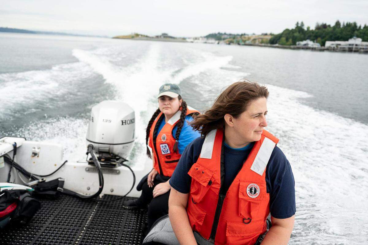 Heidi Wilken, lead dive safety officer, front, and Olivia Castro, diver, head out to an area in Puget Sound near Tacoma’s Owen Beach to survey kelp, Monday, July 24, 2023.