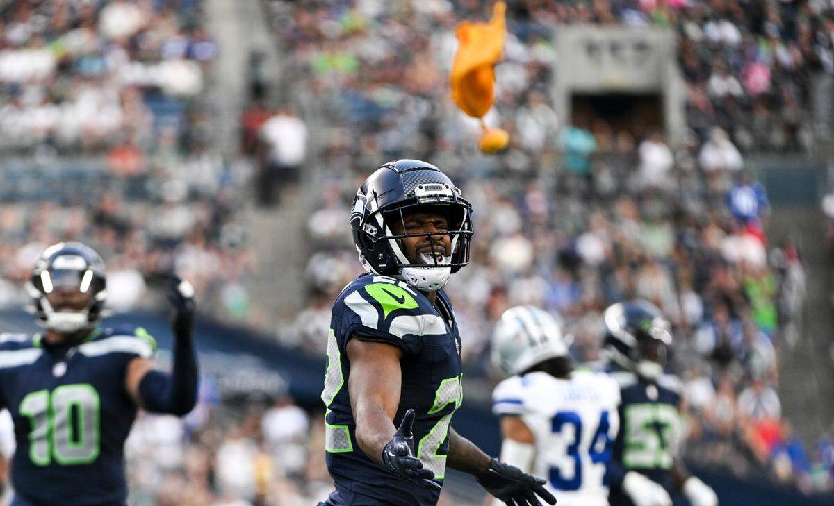Seattle Seahawks cornerback Tre Brown (22) reacts to a flag during the first quarter the preseason game against the Dallas Cowboys at Lumen Field, Saturday, Aug. 19, 2023, in Seattle, Wash.