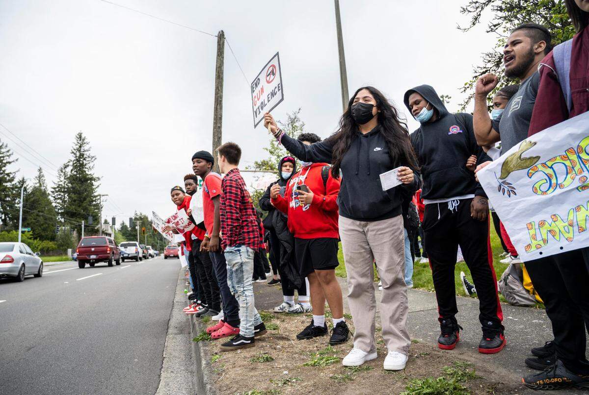 Foss High School students protest against gun violence after conducting a school walkout before their last class of the day on on the corner of South 19th Street and South Tyler Street outside of the Heidelberg Sports Complex on Thursday, May 26, 2022 in Tacoma, Wash.