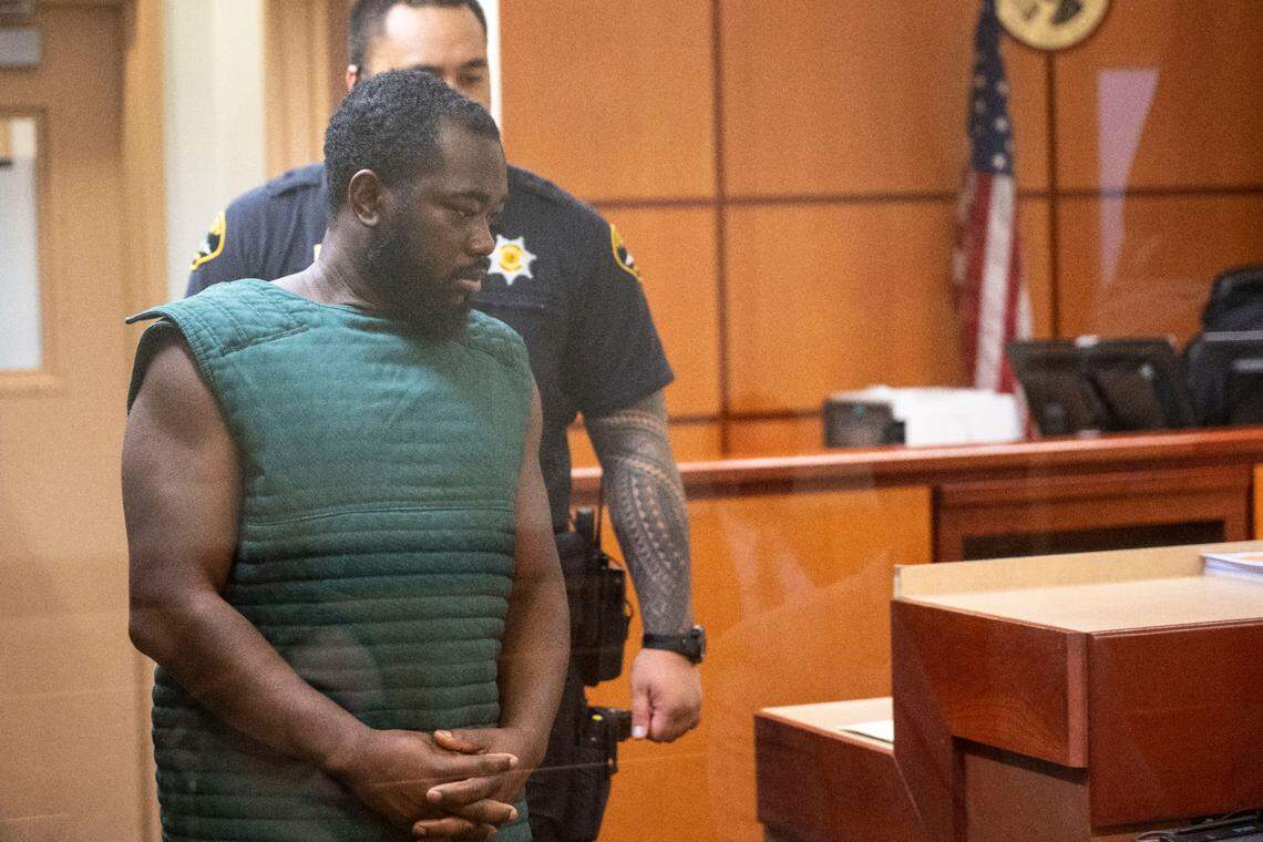 Niamkey Ange Amichia, 32, makes an initial appearance in Pierce County Superior Court on Friday, March 3, 2023, in Tacoma, Wash. Amichia, a former Puyallup police officer, is accused locally of raping a woman he met online on Oct. 7 of last year, according to charging papers for third-degree rape.