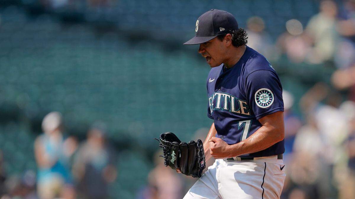 Seattle Mariners starting pitcher Marco Gonzales reacts after the final out of the top of the ninth inning of a baseball game against the Texas Rangers, Thursday, Aug. 12, 2021, in Seattle. Gonzales pitched a complete game and the Mariners won 3-1. (AP Photo/Ted S. Warren)