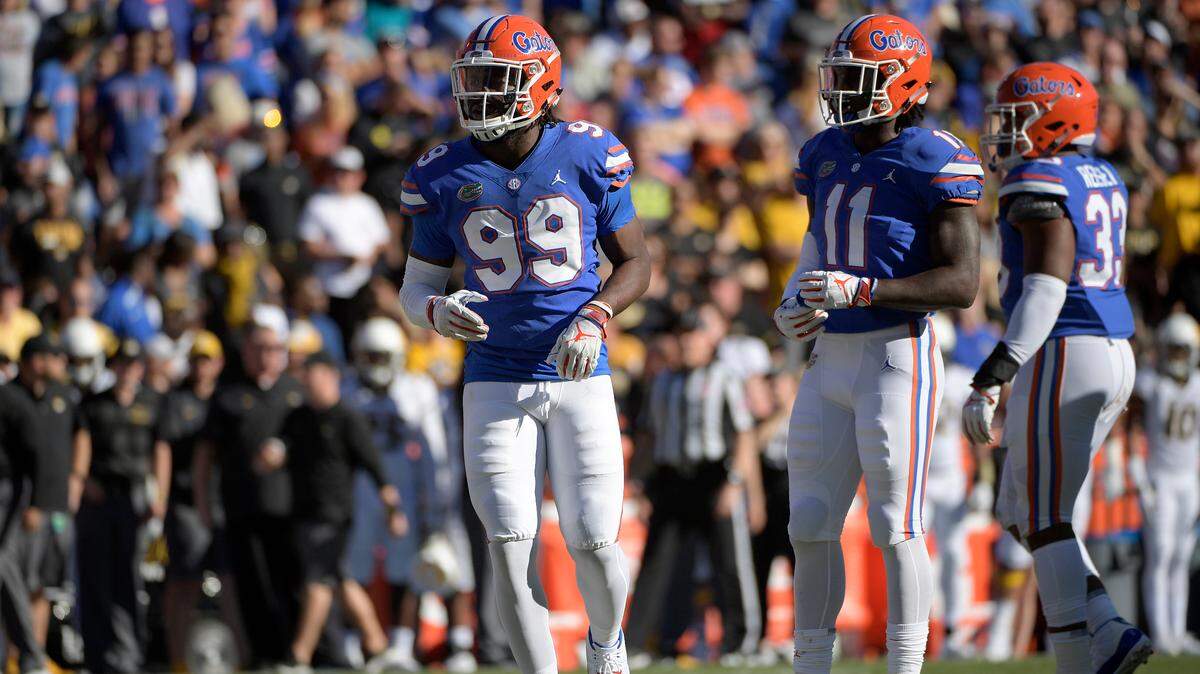 Florida linebacker Vosean Joseph (11) and defensive lineman Jachai Polite (99) set up for a play at the line of scrimmage during the first half of an NCAA college football game against Missouri Saturday, Nov. 3, 2018, in Gainesville, Fla. (AP Photo/Phelan M. Ebenhack)