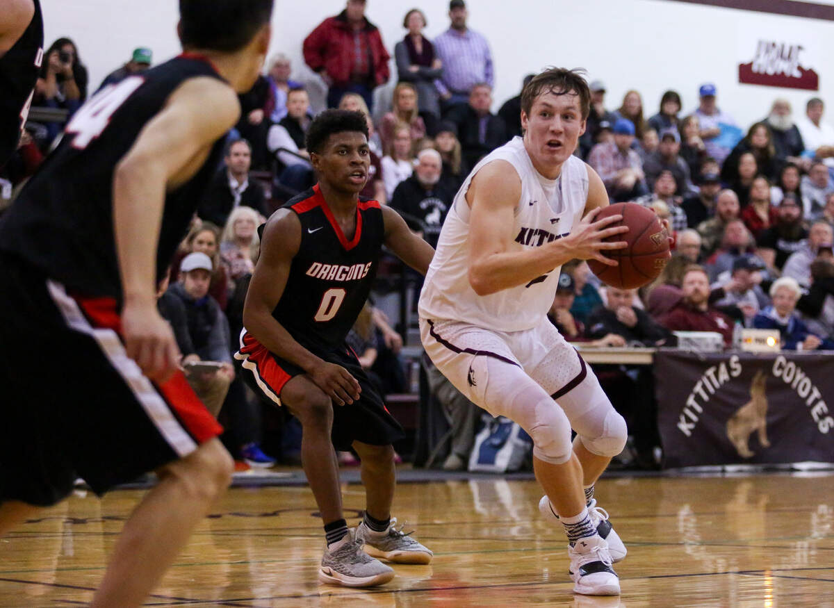 Kittitas High School’s Brock Ravet (32), drives the ball to the hoop during a game against Saint George’s on Friday, Nov. 30, 2018.