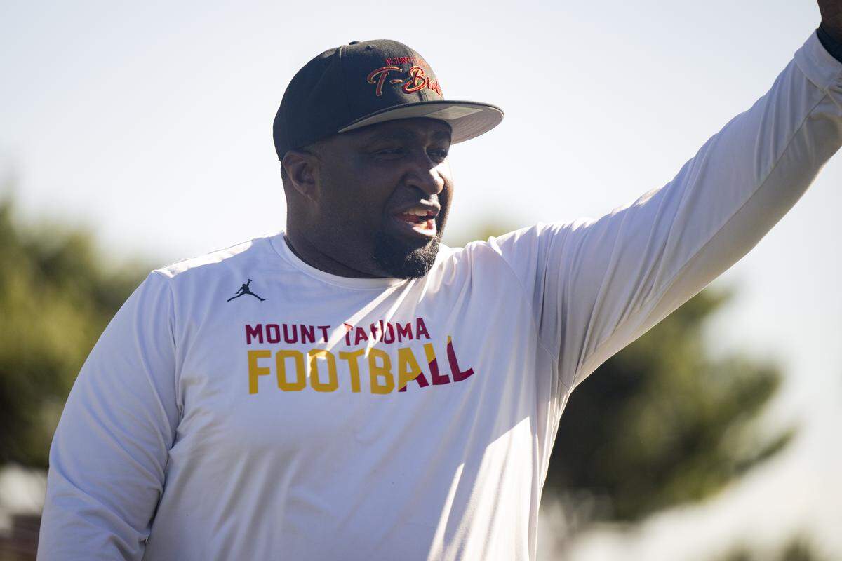 Mount Tahoma head coach Keith Terry calls to players during a football practice at Mount Tahoma High School on Wednesday, Aug. 20, 2025, in Tacoma, Wash..