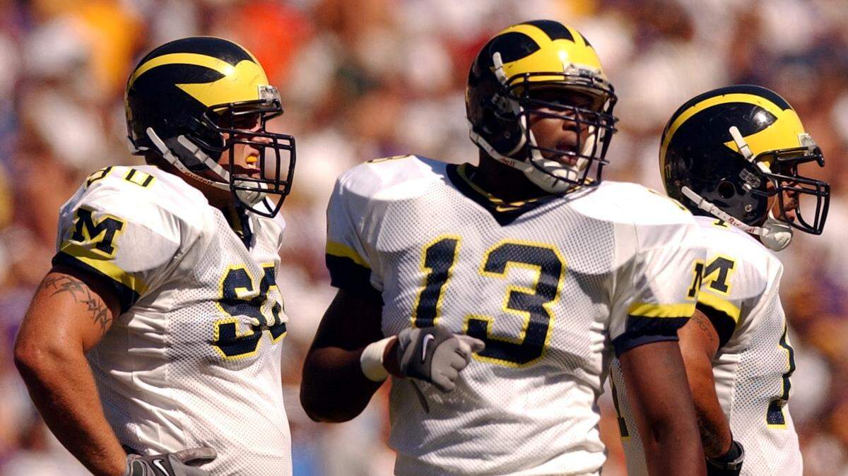Michigan defense included Larry Stevens (#13) who played prep ball at Woodrow Wilson in Tacoma. The University of Washington defeated the University of Michigan at Husky Stadium in Seattle, Wash. on Saturday, September 8, 2001. (Bruce Kellman/The News Tribune)