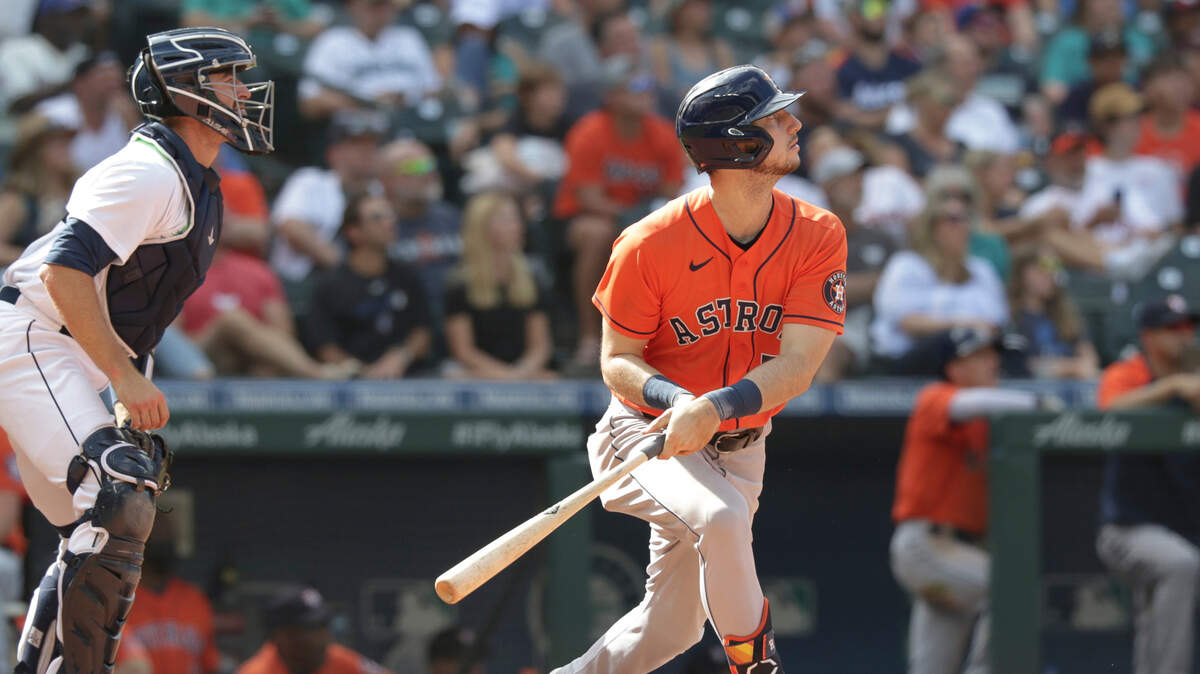 Houston Astros’ Kyle Tucker watches his two-run home run, next to Seattle Mariners catcher Tom Murphy, during the eighth inning of a baseball game Wednesday, July 28, 2021, in Seattle. (AP Photo/Jason Redmond)