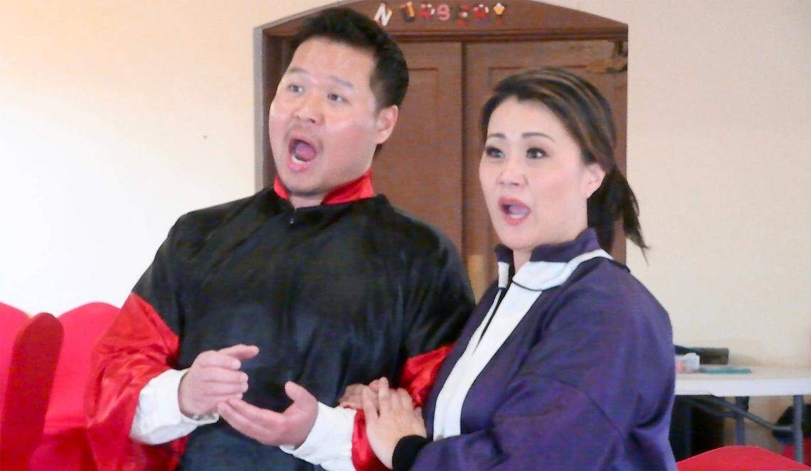 Opera singers Suchan Kim (left) and Soon Cho perform during a rehearsal for the production of “Tacoma Method” at the Christ Episcopal Church in Tacoma, Washington, on Thursday, March 16, 2023.