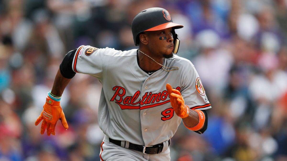 Baltimore Orioles’ Keon Broxton runs up the first base line after connecting for an RBI-double off Colorado Rockies relief pitcher Bryan Shaw in the eighth inning of a baseball game Sunday, May 26, 2019, in Denver.