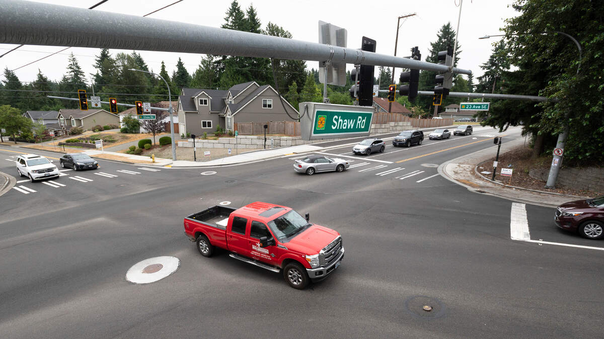 Traffic moves through the busy intersection of Shaw Road and 23rd Avenue SE in Puyallup, Washington, on Thursday, July 8, 2021.