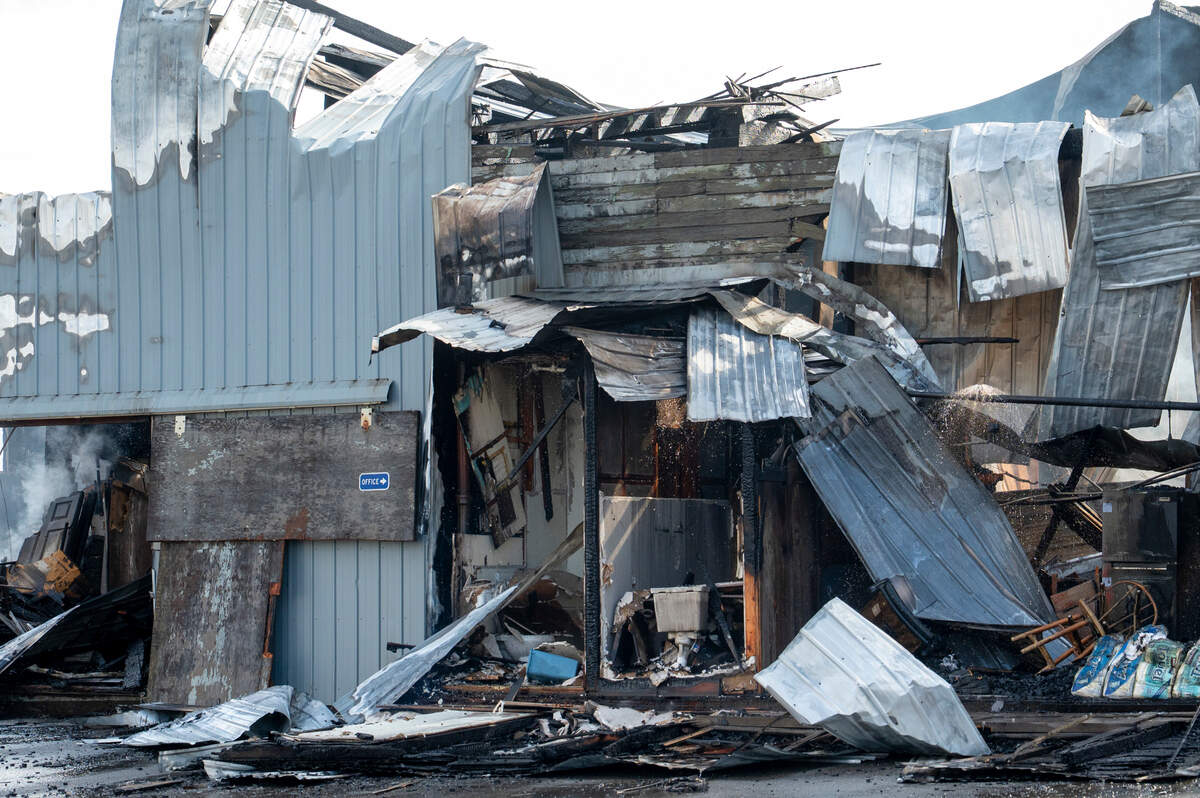 The burnt interior of Johnson’s Millwork is visible on Monday, July 14, 2025, after the manufacturing building was destroyed in an overnight fire Sunday. Fire crews continue to extinguish hot spots at the site on Monday.