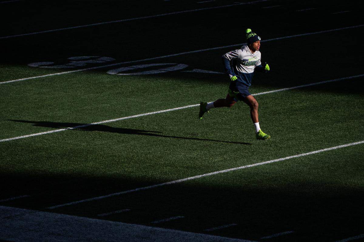 Seattle Seahawks wide receiver Tyler Lockett warms up before the game. The Seattle Seahawks played the Los Angeles Rams in a NFL wildcard playoff game at Lumen Field in Seattle, Wash., on Saturday, Jan. 9, 2021.