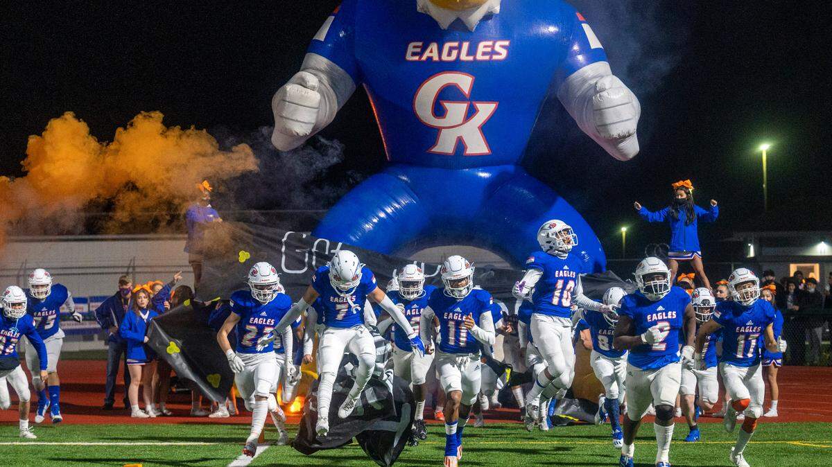Graham-Kapowsin players run onto the field prior to the start of a State 4A quarterfinal game against Bothell on Friday night at Art Crate Field in Spanaway.